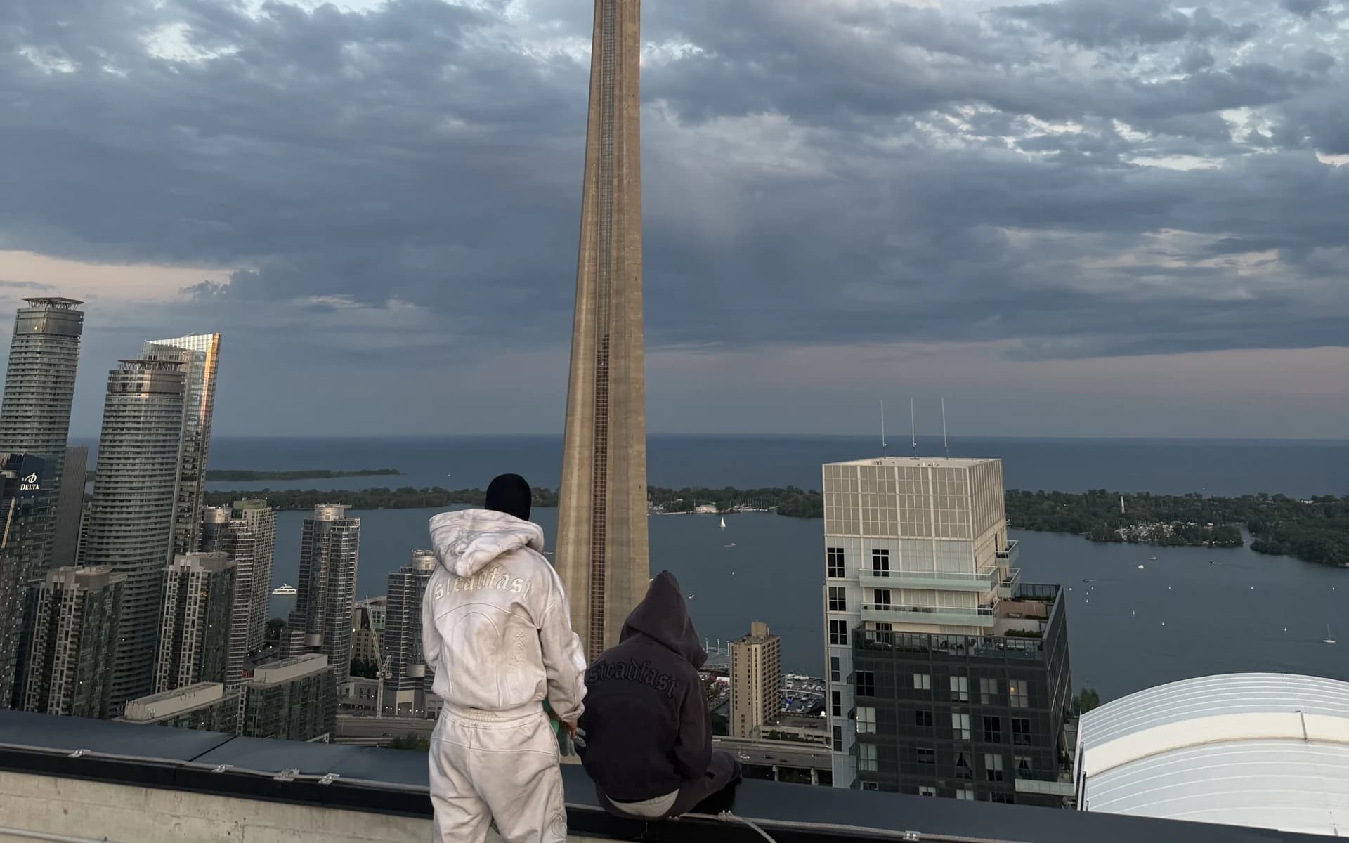 Steadfast rooftop scene with the Toronto skyline in the background.